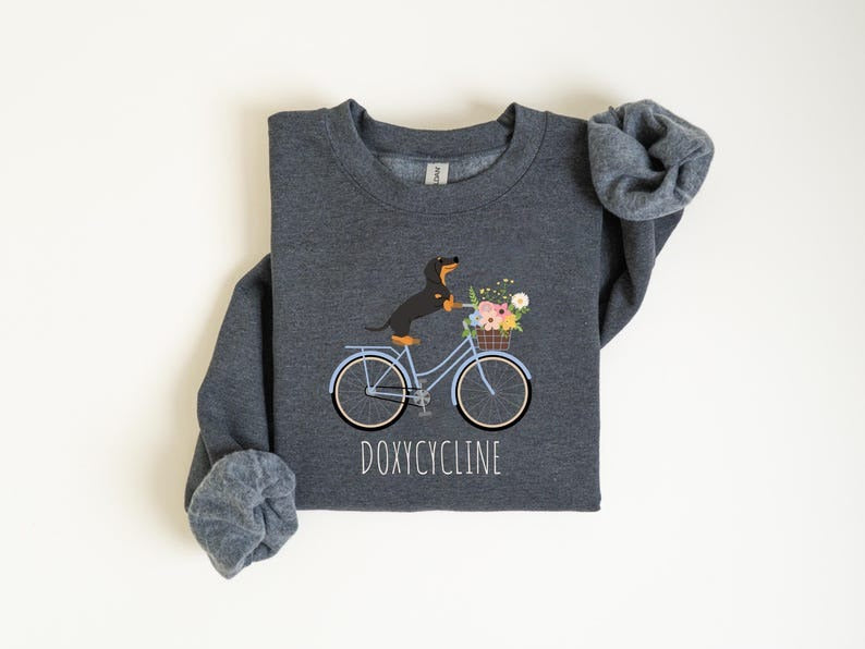 Doxycycline Pharmacy Pun Sweatshirt, Dachshund on Bicycle
