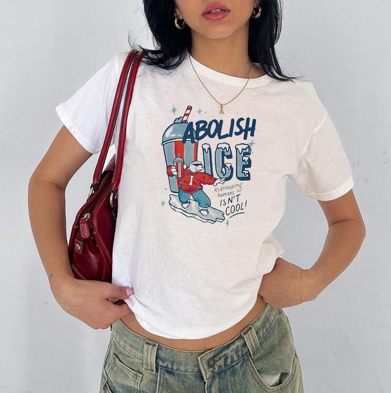 Abolish ICE women's baby tee, No Human Is Illegal Tee, Immigrant Rights Political Shirt